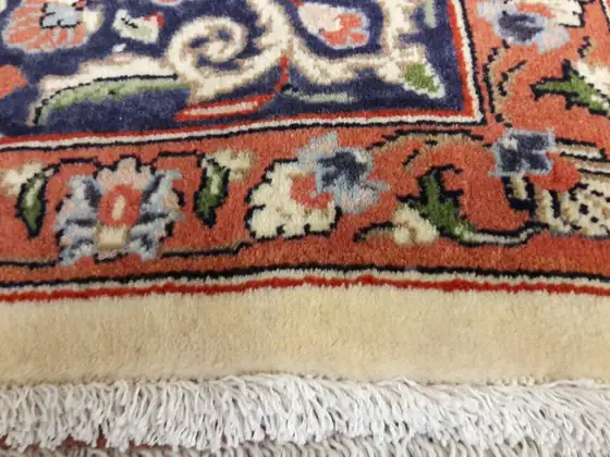 Bordure et franges d'un tapis de Tabriz.